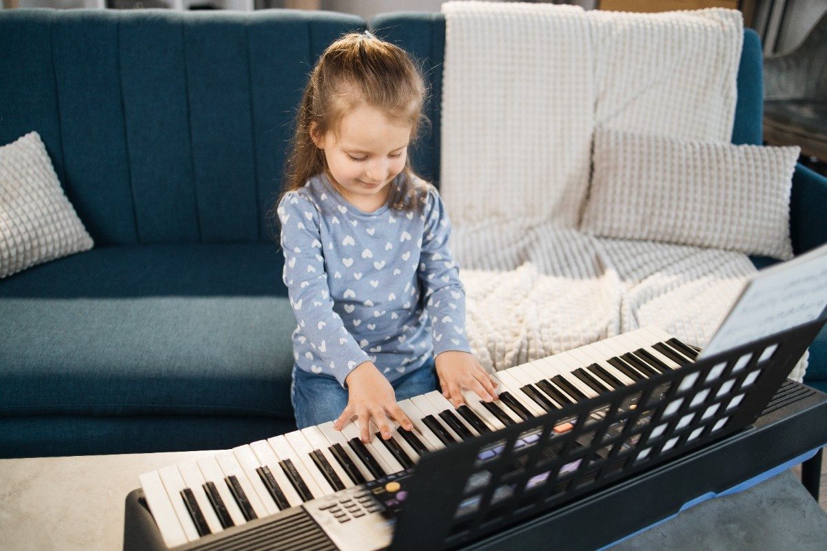 Little girl playing the piano