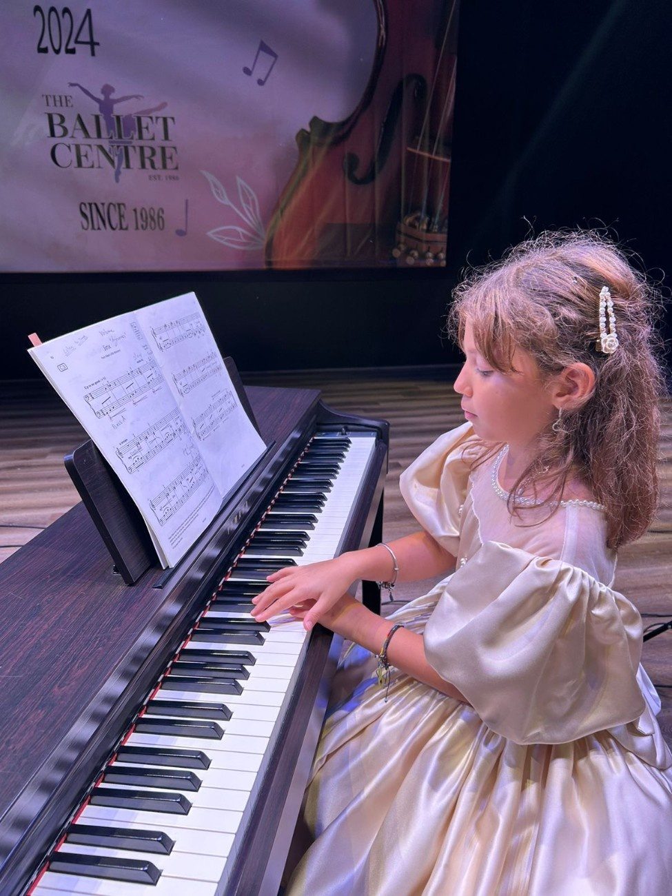 young girl playing the piano