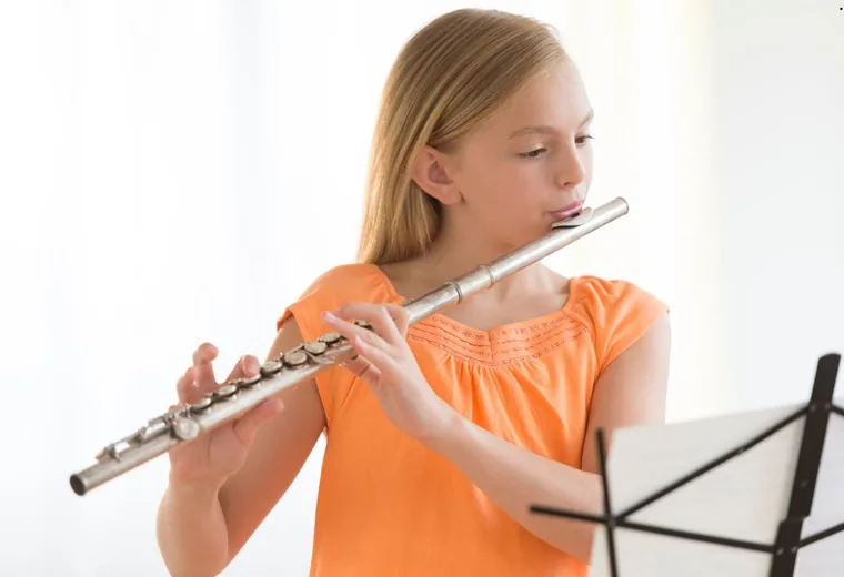 A student playing the flute