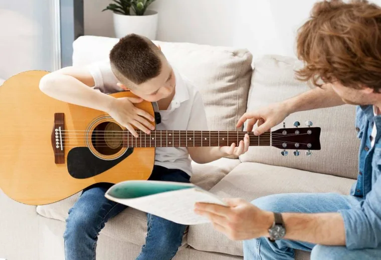 A guitar lesson in progress