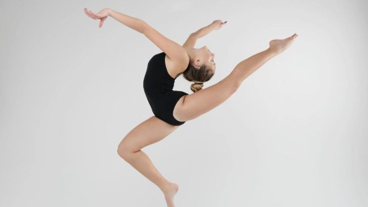 A dancer in mid air pose