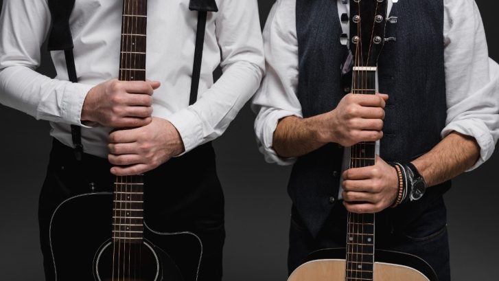 cropped-shot-of-duet-of-musicians-with-acoustic-guitars